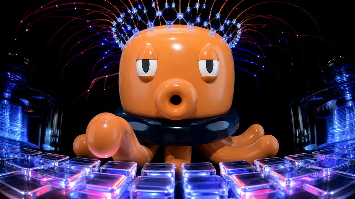 Mascotte MeKraken in un laboratorio AI con sensori cerebrali e tastiera di vetro